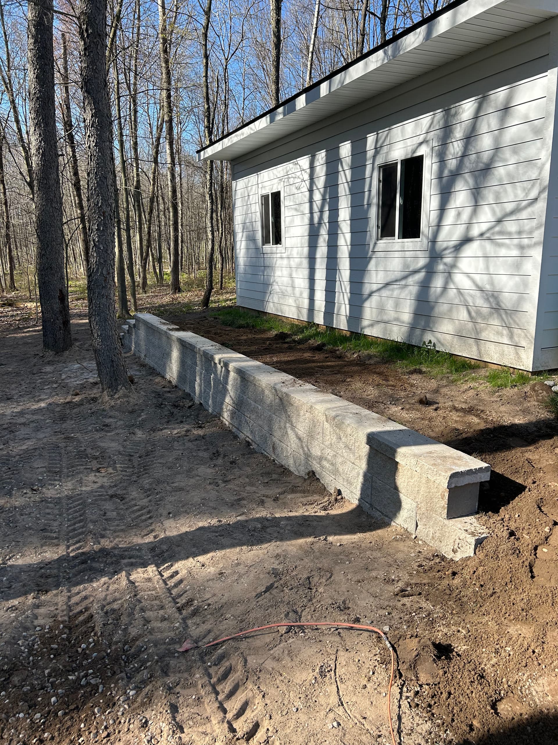 Concrete Block Retaining Wall Built to Hold and Impress image